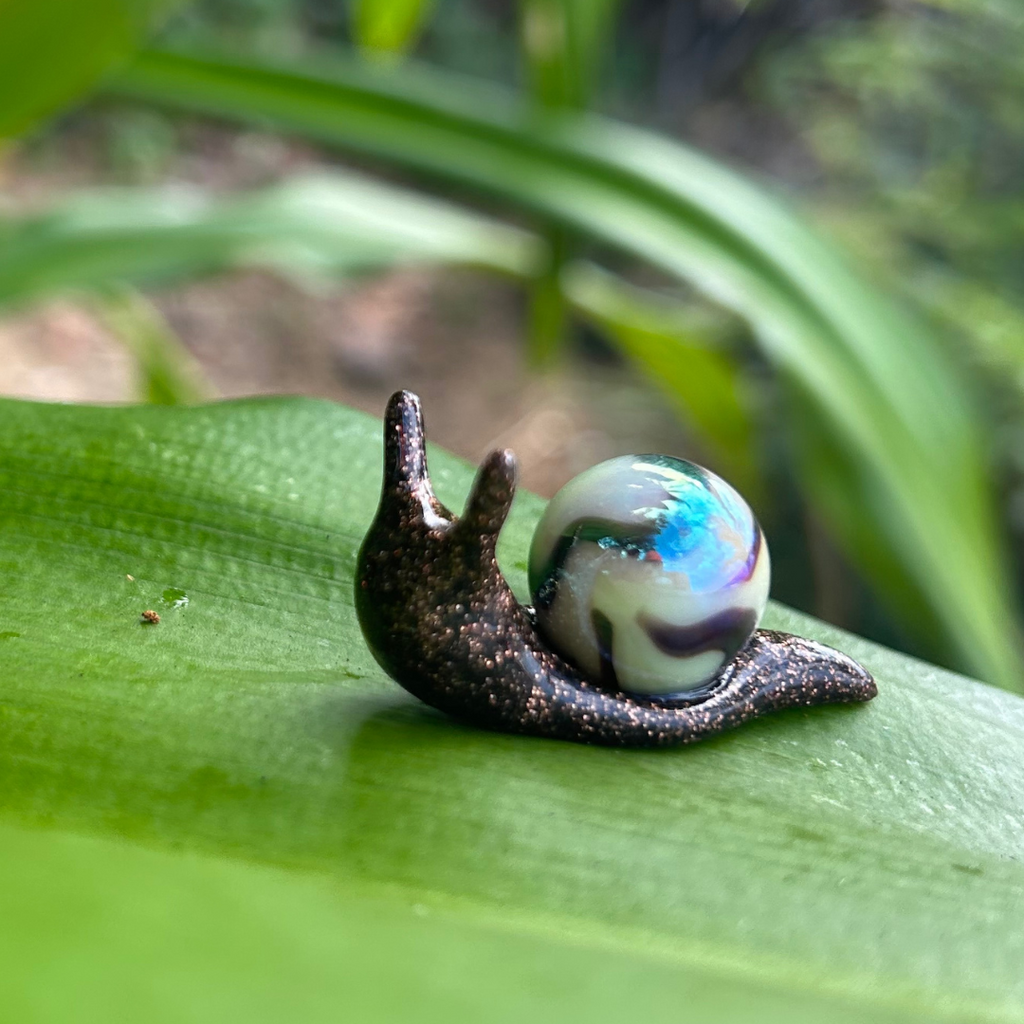 Cafe Snarble, brown glittery snail with creamy white and brown marble left